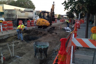 Despite signs on the construction site of The Streetscape Project in Palo Alto indicating that businesses are open during construction, local businesses along California Avenue have suffered due to loss of street and pedestrian traffic. The Streetscape Project, an effort to improve the aesthetic conditions of Palo Alto’s Business District, broke ground in spring and will not be completed until March 2015. (Alex Hicks/Peninsula Press)