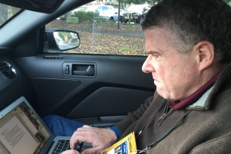 Peter King types his notes after leaving Broncos practice at Stanford Stadium on Feb. 3, 2016. (Shane Newell / Peninsula Press).