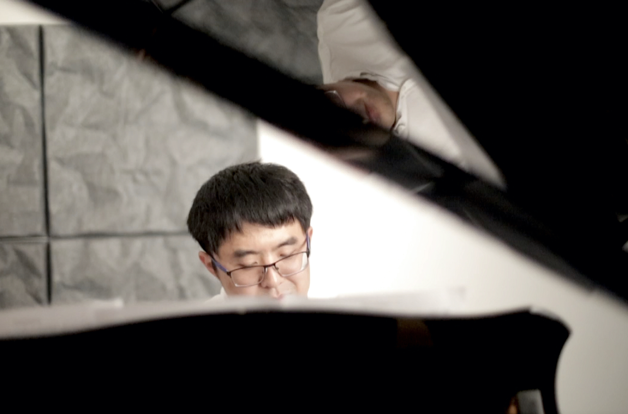 Yi Yin, 37, plays the piano in a music studio in Palo Alto, on Monday, October 14, 2019. Yin composes the piano piece, which he names after the protest, “September 26th Piano Sonata”. (Qian Chen/Peninsula Press)