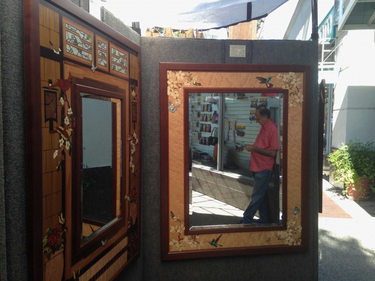 Stan Salah waits for customers for his hand-crafted mirrors at the Menlo Park Fine Arts & Crafts Fall Fest on Oct. 5, 2014 in Menlo Park, Calif. (Miranda Shepherd/Peninsula Press)
