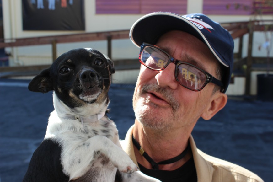 Christopher Dodenhoff and his dog Candie inside the Navigation Center in downtown San Francisco on Oct. 29, 2015. The shelter has one of the most welcoming policies in the Bay Area toward homeless pet-owners. (Jamie Stark/Peninsula Press)