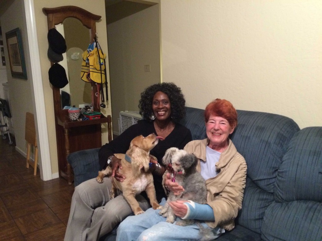 Kim Hester, left, and her two dogs, Freckles and Fluffy, moved in with retiree Pat Boyd, right, in October 2015. Hester plans to remain in Boyd’s San Mateo home until she retires to Alabama in two or three years. (An-Li Herring/Peninsula Press)