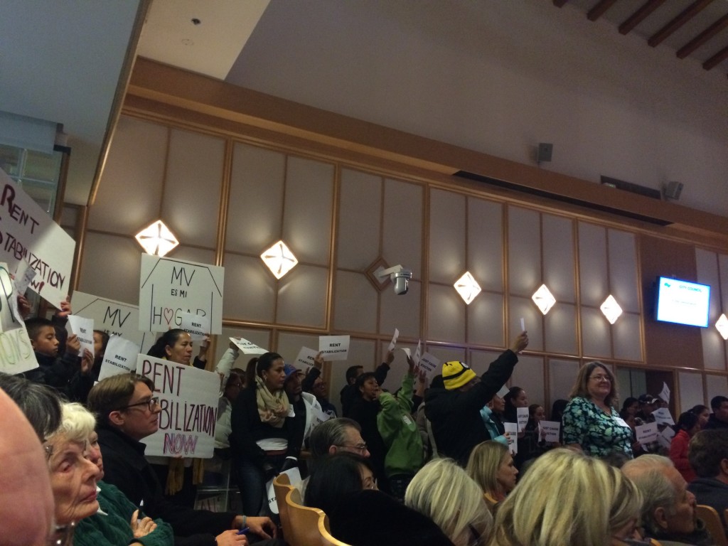 Dozens of the Mountain View Tenants Coalition members demonstrated continued support for rent stabilization and just-cause eviction policies at the Mountain View City Council meeting on Dec. 1, 2015. The city council rejected both policies at an Oct. 19 study session. (An-Li Herring/Peninsula Press)