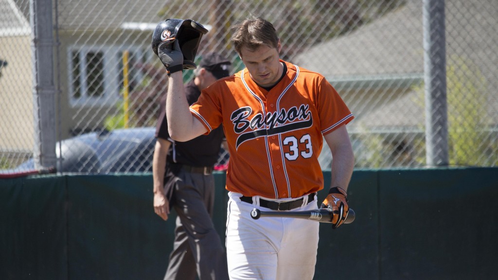 Scott Botterman walks toward the dugout in a loss to the Wood on May 1 in Berkeley. (Shane Newell/Peninsula Press)