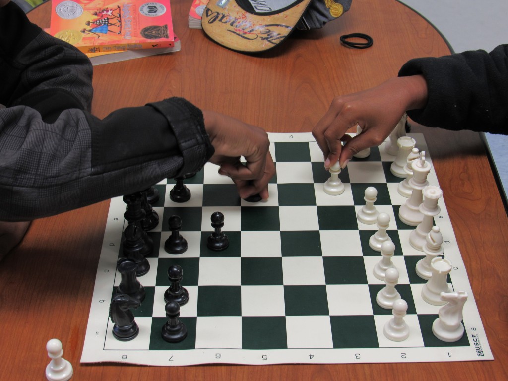 Students play chess to begin their day in the classroom.