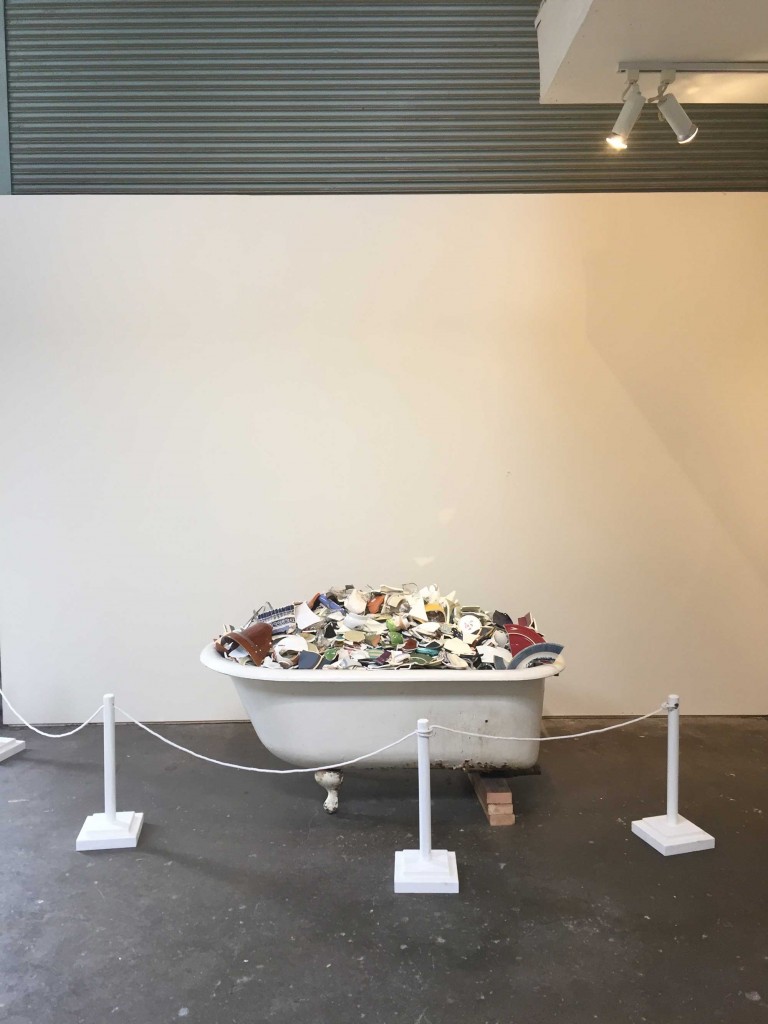 A bathtub full of polished ceramic shards is one of the centerpieces of Ramekon O'Arwisters "Smooth the edges" show, part of the Recology Artists in Residence Open Studios on Jan. 20 and 21, 2017, at Recology's San Francisco Transfer Station. (Dylan Anslow/Peninsula Press)