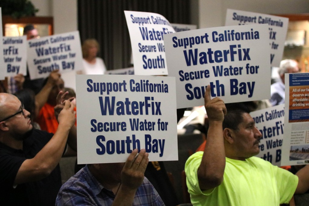 Union members hold signs in support of WaterFix