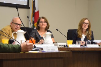 Interim Superintendent Karen Hendricks, right, addresses parents at the Palo Alto Unified School District board meeting on Oct. 10.