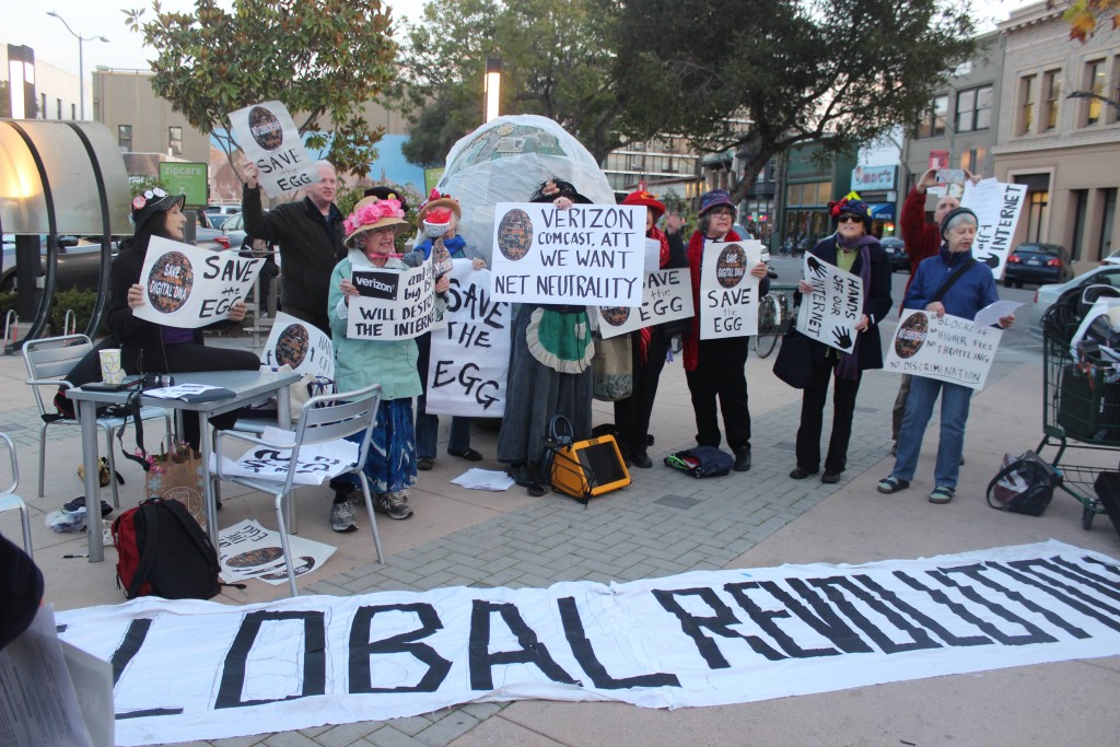 Protestors gather in front of "Digital DNA" at a rally to save the sculpture on Dec. 7.