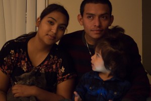 Jaritza Hernandez, her husband and Alexa pose for a family picture in their apartment. After being homeless for six months, the family is very happy to have a home of their own where Alexa can run around and play and be safe.