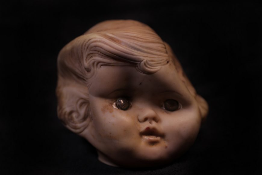 A doll’s head found at the site of the old landfill. (Jackie Botts/Peninsula Press)