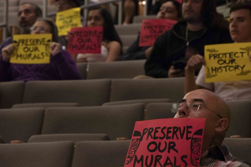 Residents hold up signs during a Historic Landmarks Commission meeting in San Jose, Calif., on Wednesday, Oct. 2, 2019. (Vanessa Ochavillo/Peninsula Press)