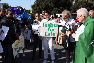 Crowd gathers outside St Francis of Assisi Church in EPA for justice march
