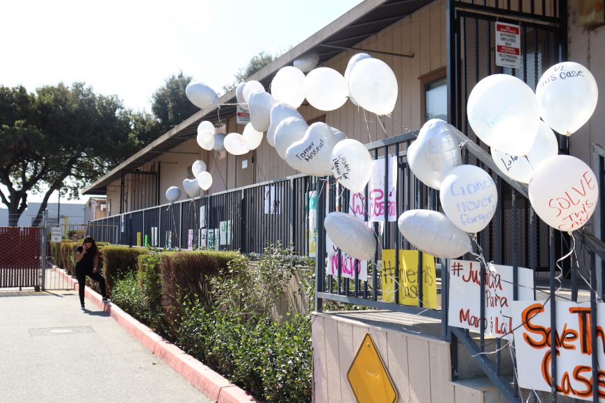 Balloons and signs line the railing at the East Palo Alto Police Department following the march for justice on Sunday, Oct. 13, 2019. (Astrid Casimire/Peninsula Press)