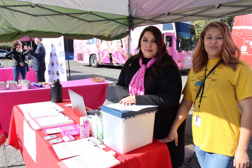 Health educators of Life Saving Images Yuri Fong and Jerica Cook stand ready to provide educational resources to East Palo Alto residents at the launch the four-day, mobile screening clinic in East Palo Alto. (Astrid Casimire/Peninsula Press)