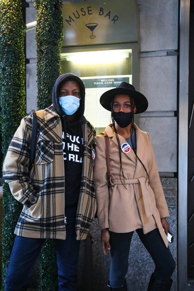 Shakeem (identified by first name only) and Aalia Cox leave the polls at Times Square proudly
sporting “I Voted” stickers. (Iman Floyd-Carroll/Peninsula Press)