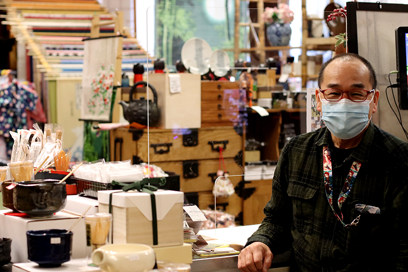 Asakichi Sakakihara poses for a photo in his store on Oct. 13, 2021. He opened the store in San Francisco Japantown in 1980, two years after coming to the United States.  (Natasha Jessen-Petersen/Peninsula Press)