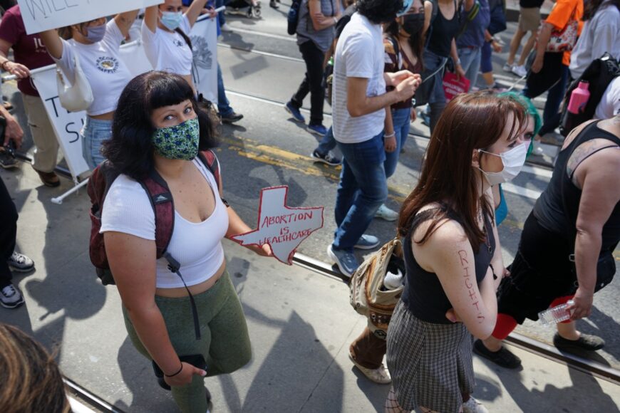 A protester walks alongside thousands at San Francisco’s Rally for Abortion Justice on Oct. 2, 2021. (Elissa Miolene/Peninsula Press)
