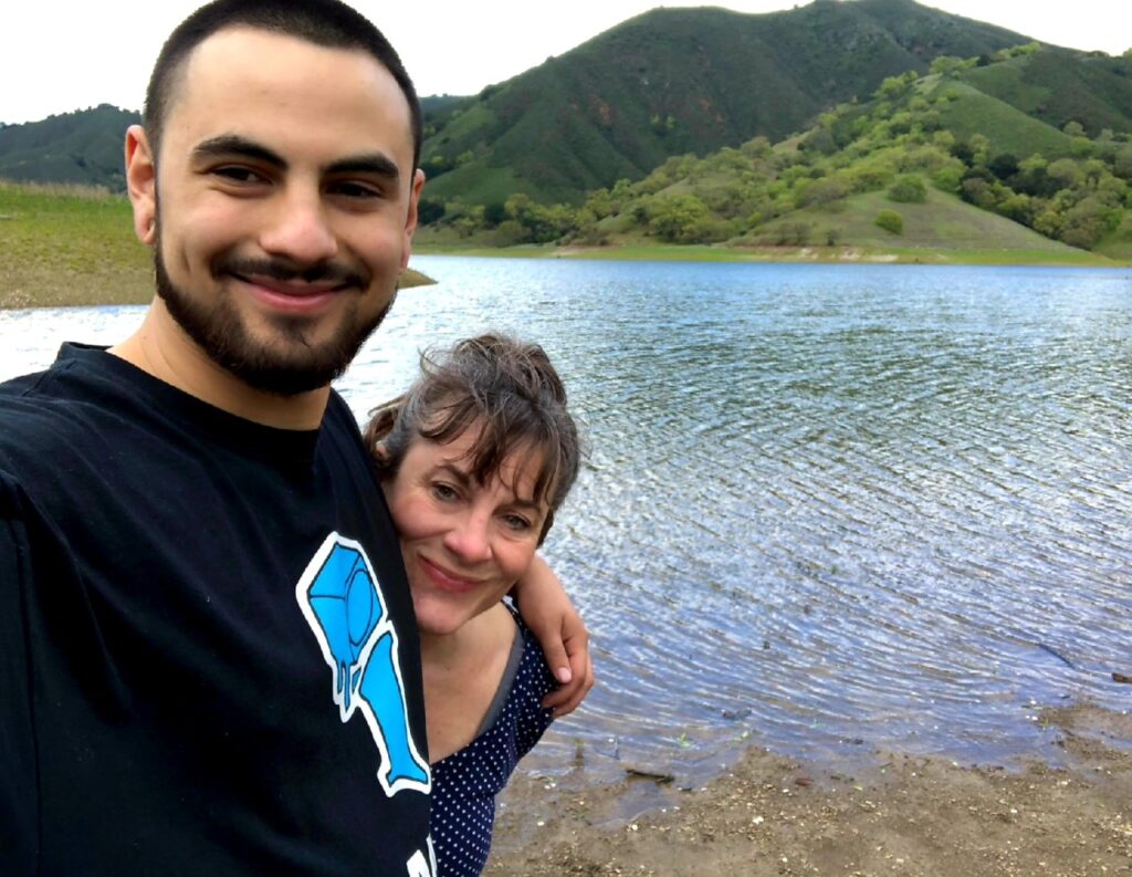 A photo of Jacob with an arm around his mother, Geralyn Vasquez.