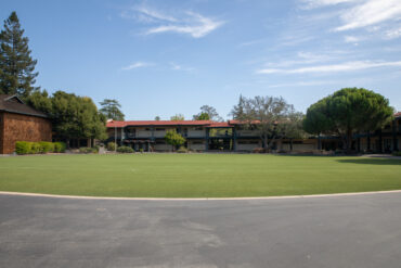 A photo of Castilleja school behind a wide green lawn