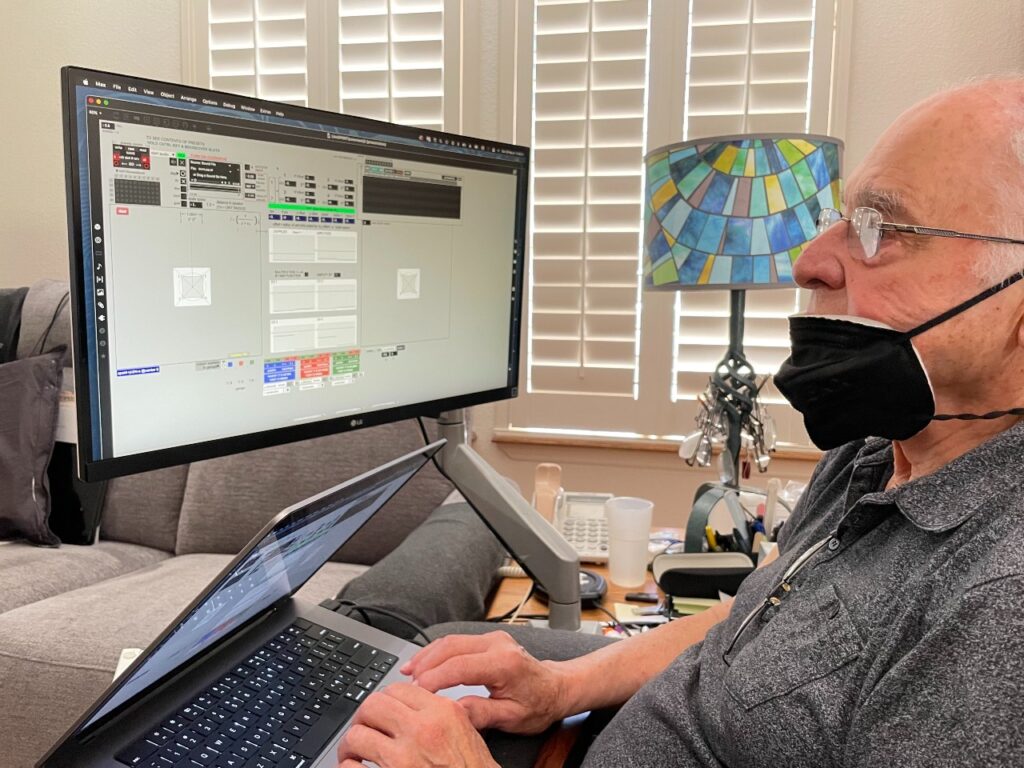 John Chowning sits in front of a laptop and monitor