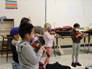 music training beginning at an early age improves auditory processing skills.