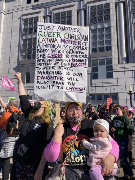 Stefani Echeverría-Fenn and her baby joined other protesters in a rally in support of abortion rights outside San Francisco Public Library, across the street from the anti-abortion West Coast Walk for Life rally. (Kevi Johnson/Peninsula Press)