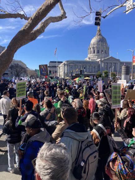 A line of police separate thousands of anti-abortion rights supporters and the smaller counterrally. (Kevi Johnson/Peninsula Press)
