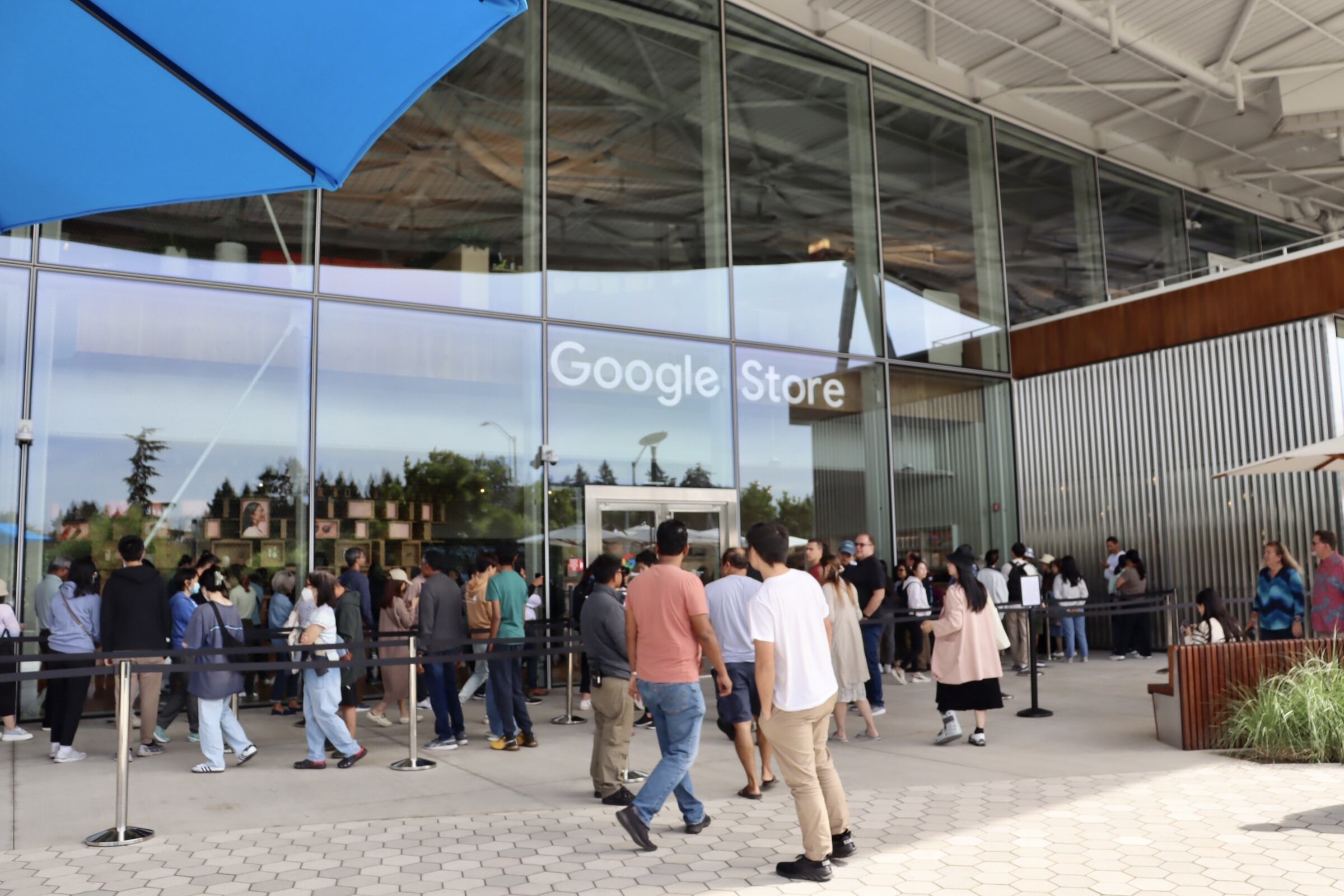 Crowds stand outside of the Google Store