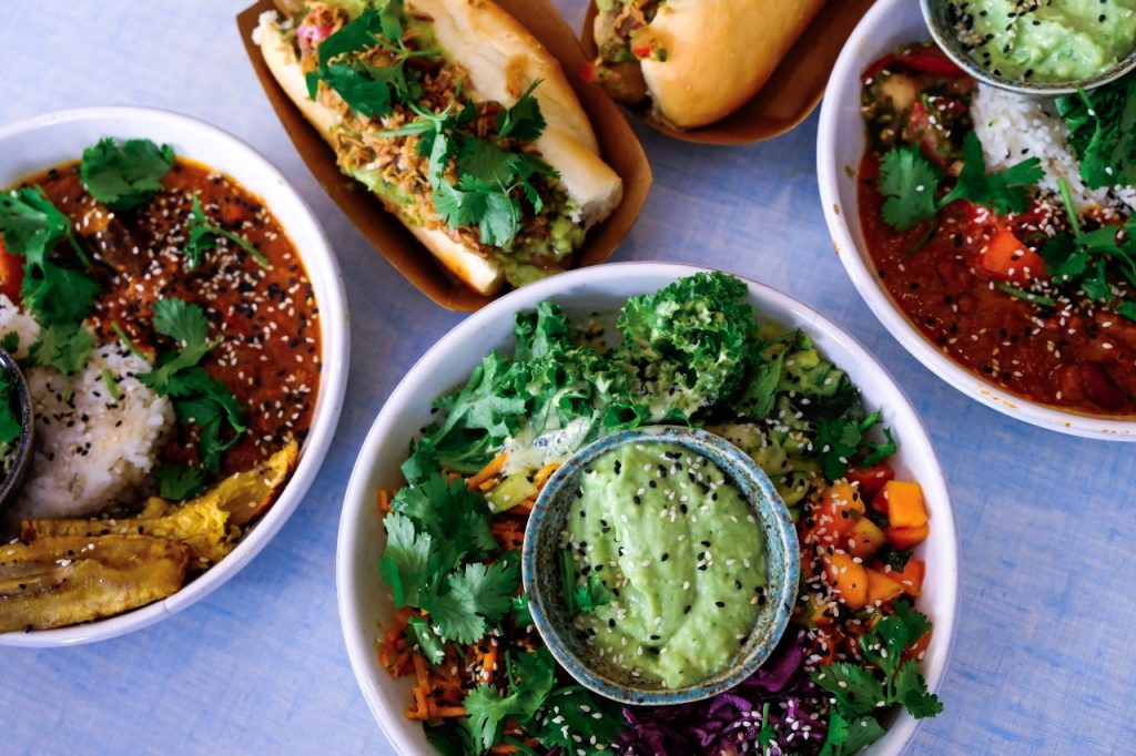 Colorful bowls of plant-based foods.