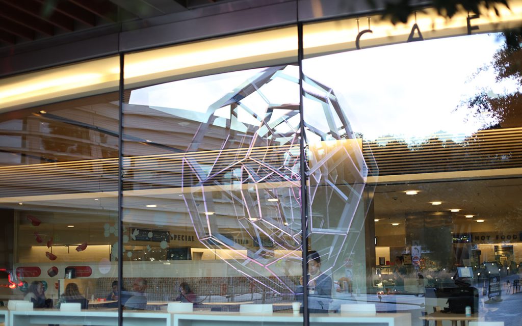 A photo looking through a cafe's glass windows.