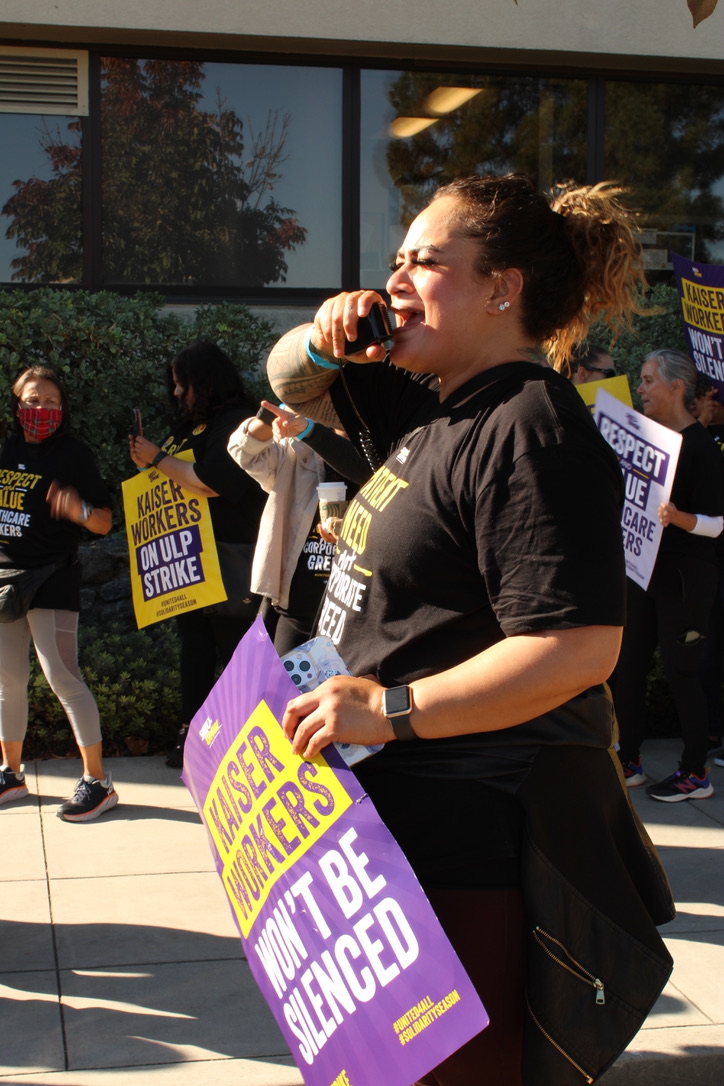 Strike leaders uses a megaphone to address the crowd